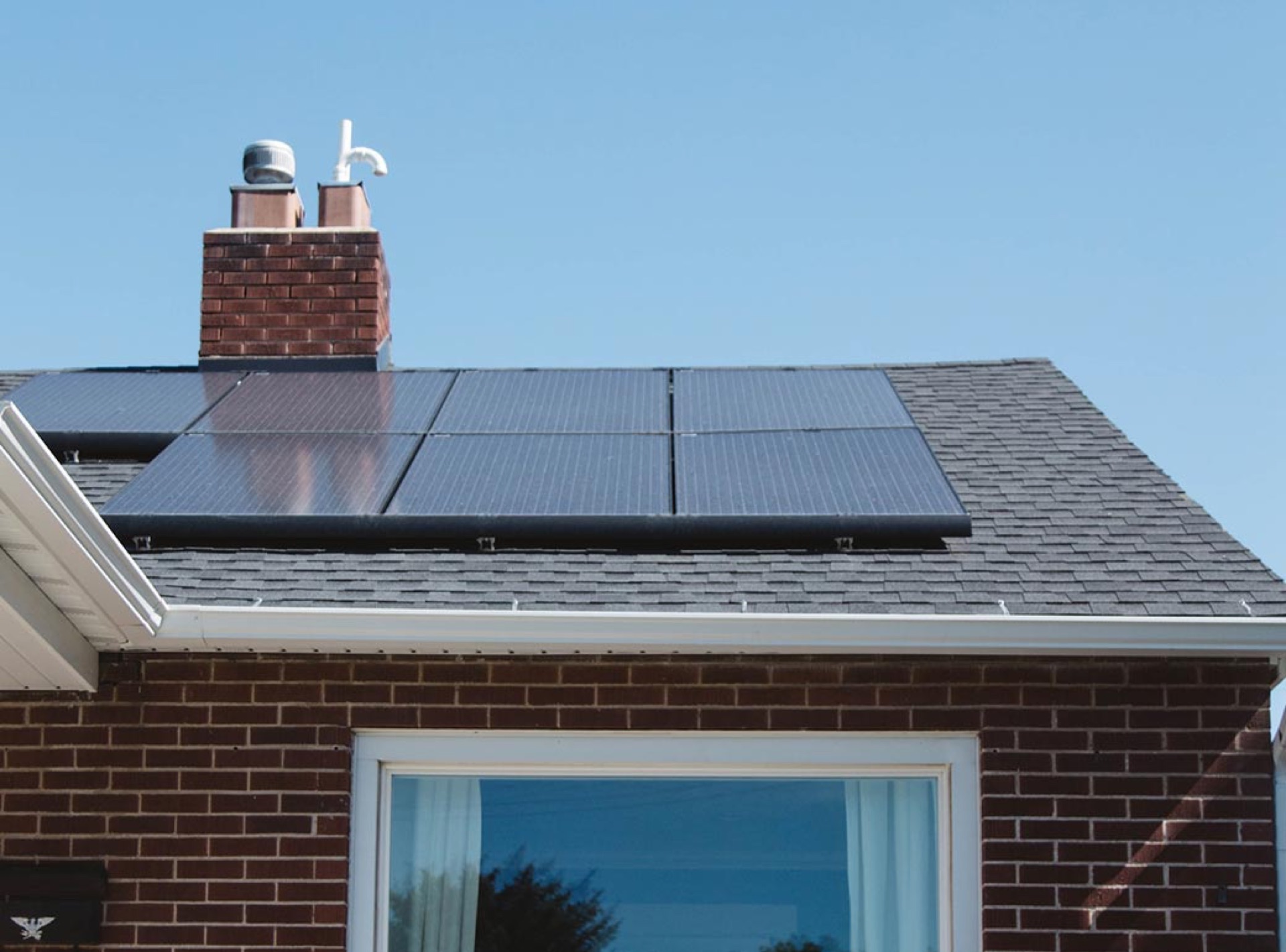 Cleaning solar panels on a residential rooftop